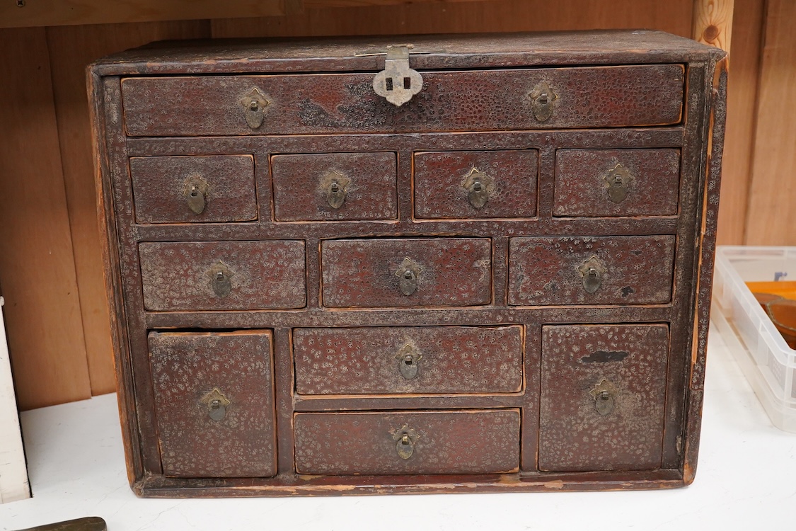An 18th century Chinese lacquered table top cabinet, 52cm wide